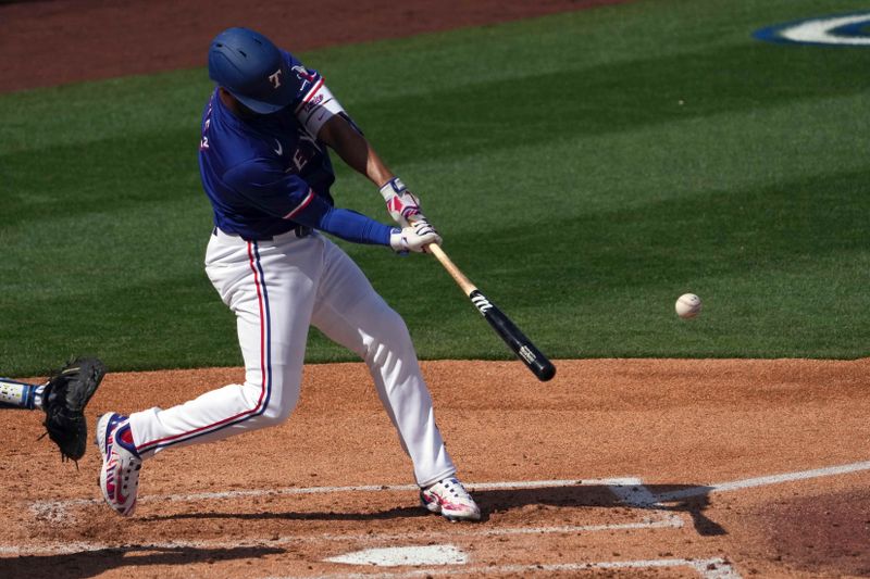 Feb 28, 2024; Surprise, Arizona, USA; Texas Rangers second baseman Marcus Semien (2) bats against the Los Angeles Dodgers during the third inning at Surprise Stadium. Mandatory Credit: Joe Camporeale-USA TODAY Sports