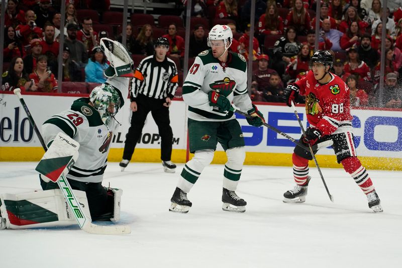 Oct 4, 2024; Chicago, Illinois, USA; Minnesota Wild goaltender Marc-Andre Fleury (29) makes a save against Chicago Blackhawks center Teuvo Teravainen (86) during the third period at United Center. Mandatory Credit: David Banks-Imagn Images