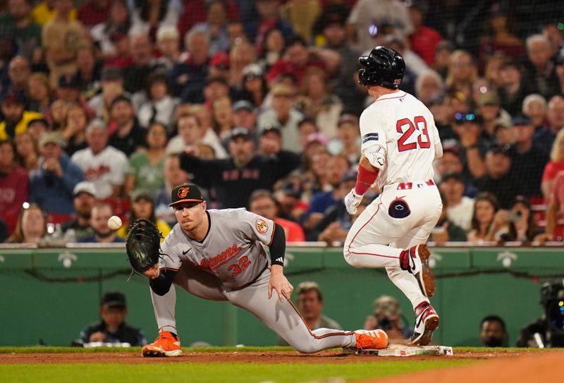 Sep 9, 2024; Boston, Massachusetts, USA; Boston Red Sox second baseman Romy Gonzalez (23) gets a base hit against Baltimore Orioles first baseman Ryan O'Hearn (32) in the sixth inning at Fenway Park. Mandatory Credit: David Butler II-Imagn Images