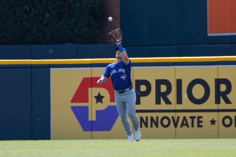 May 26, 2024; Detroit, Michigan, USA; Toronto Blue Jays outfielder Daulton Varsho (25) catches a fly ball in the first inning agains the Detroit Tigers at Comerica Park. Mandatory Credit: Brian Bradshaw Sevald-USA TODAY Sports