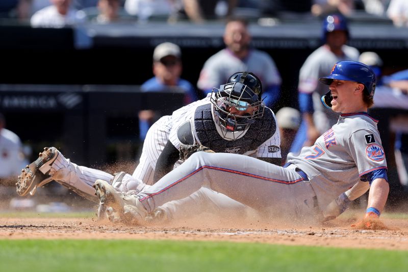 May 17, 2025; Bronx, New York, USA; New York Yankees catcher J.C. Escarra (25) tags out New York Mets third baseman Brett Baty (7) trying to score on a double by Mets center fielder Tyrone Taylor (not pictured) during the seventh inning at Yankee Stadium. Mandatory Credit: Brad Penner-Imagn Images