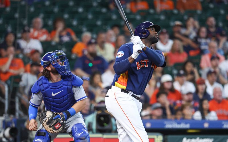 Sep 24, 2023; Houston, Texas, USA; Houston Astros left fielder Yordan Alvarez (44) hits a single during the first inning against the Kansas City Royals at Minute Maid Park. Mandatory Credit: Troy Taormina-USA TODAY Sports