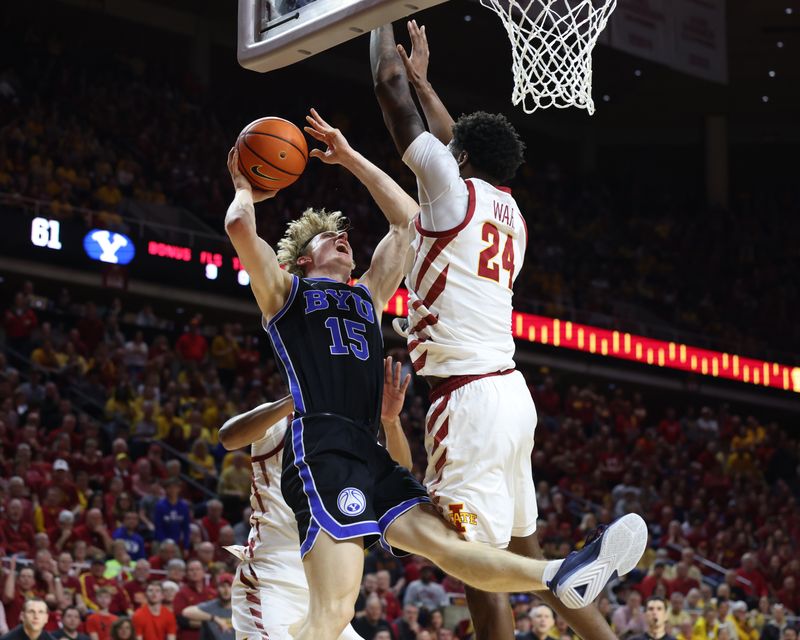 Mar 6, 2024; Ames, Iowa, USA; Brigham Young Cougars guard Richie Saunders (15) is defends Iowa State Cyclones forward Hason Ward (24) in the second half at James H. Hilton Coliseum. Mandatory Credit: Reese Strickland-USA TODAY Sports

