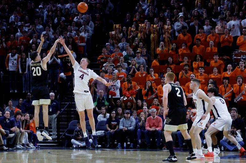 Feb 17, 2024; Charlottesville, Virginia, USA; Wake Forest Demon Deacons guard Parker Friedrichsen (20) shoots the ball as Virginia Cavaliers guard Andrew Rohde (4) defends in the second half at John Paul Jones Arena. Mandatory Credit: Geoff Burke-USA TODAY Sports