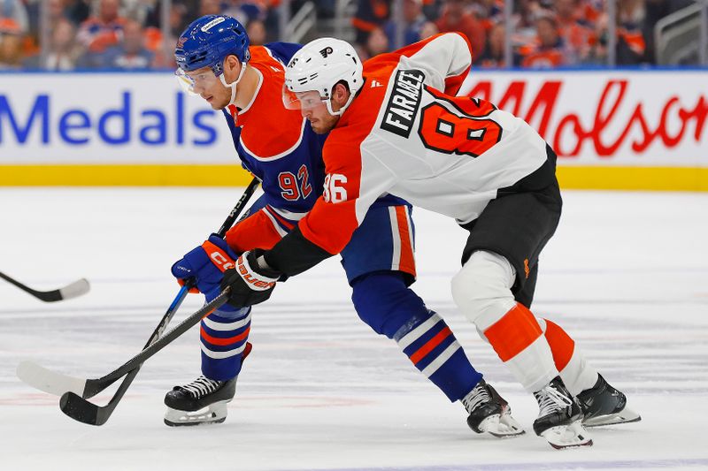 Oct 15, 2024; Edmonton, Alberta, CAN; Philadelphia Flyers forward Joel Farabee (86) and Edmonton Oilers forward Vasily Podkolzin (92) battle for a loose puck  during the first period  at Rogers Place. Mandatory Credit: Perry Nelson-Imagn Images