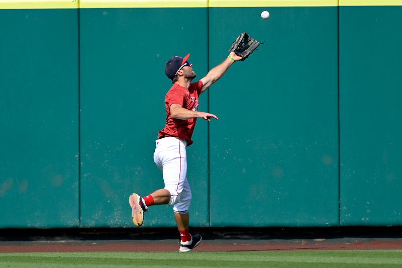 May 26, 2025; Anaheim, California, USA;  Los Angeles Angels center fielder Chris Taylor (33) warms up in the outfield prior to the game against the New York Yankees at Angel Stadium. Mandatory Credit: Jayne Kamin-Oncea-Imagn Images