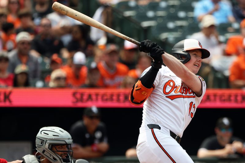 Jun 1, 2025; Baltimore, Maryland, USA; Baltimore Orioles outfielder Heston Kjerstad (13) hits a triple during the fourth inning against the Chicago White Sox at Oriole Park at Camden Yards. Mandatory Credit: Daniel Kucin Jr.-Imagn Images