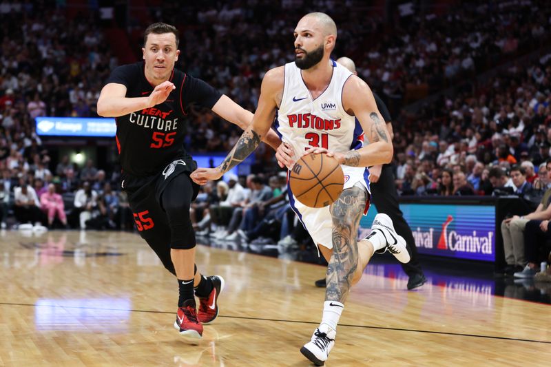 MIAMI, FLORIDA - MARCH 05: Evan Fournier #31 of the Detroit Pistons drives against Duncan Robinson #55 of the Miami Heat during the fourth quarter of the game at Kaseya Center on March 05, 2024 in Miami, Florida. NOTE TO USER: User expressly acknowledges and agrees that, by downloading and or using this photograph, User is consenting to the terms and conditions of the Getty Images License Agreement. (Photo by Megan Briggs/Getty Images)