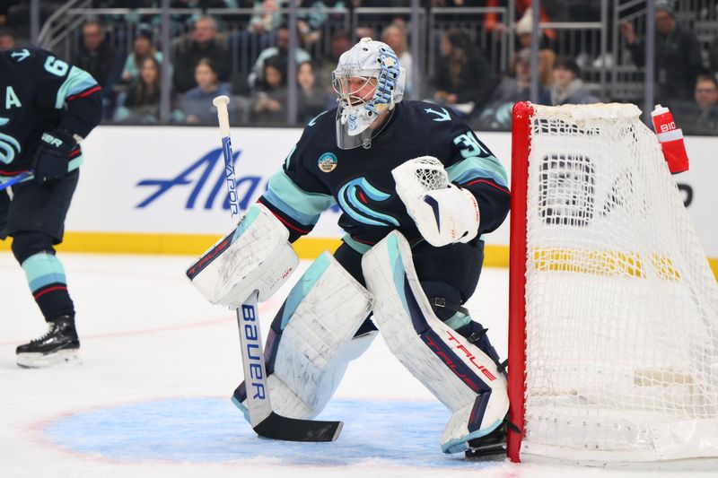 Feb 22, 2024; Seattle, Washington, USA; Seattle Kraken goaltender Philipp Grubauer (31) defends the goal against the Vancouver Canucks during the first period at Climate Pledge Arena. Mandatory Credit: Steven Bisig-USA TODAY Sports