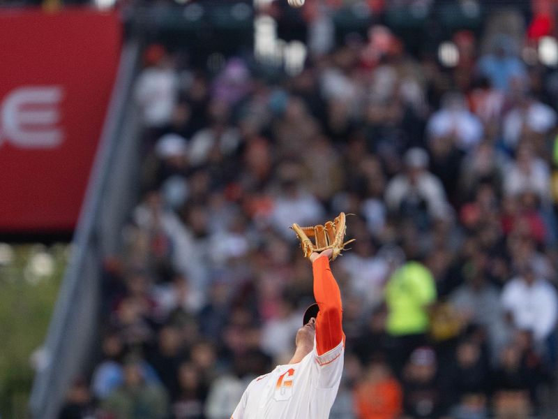 May 28, 2024; San Francisco, California, USA;  San Francisco Giants third base Matt Chapman (26) catches the ball during the fifth inning against the Philadelphia Phillies at Oracle Park. Mandatory Credit: Stan Szeto-USA TODAY Sports
