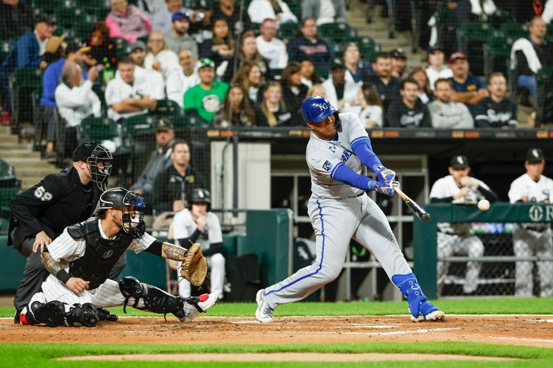 Sep 13, 2023; Chicago, Illinois, USA; Kansas City Royals catcher Salvador Perez (13) singles against the Chicago White Sox during the third inning at Guaranteed Rate Field. Mandatory Credit: Kamil Krzaczynski-USA TODAY Sports