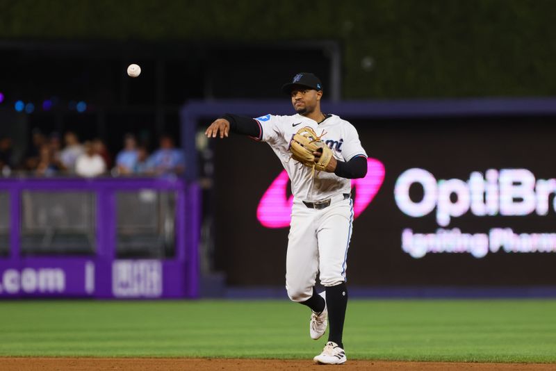 Sep 5, 2024; Miami, Florida, USA; Miami Marlins shortstop Xavier Edwards (63) throws to first base to retire Philadelphia Phillies first baseman Bryce Harper (not pictured) during the fifth inning at loanDepot Park. Mandatory Credit: Sam Navarro-Imagn Images