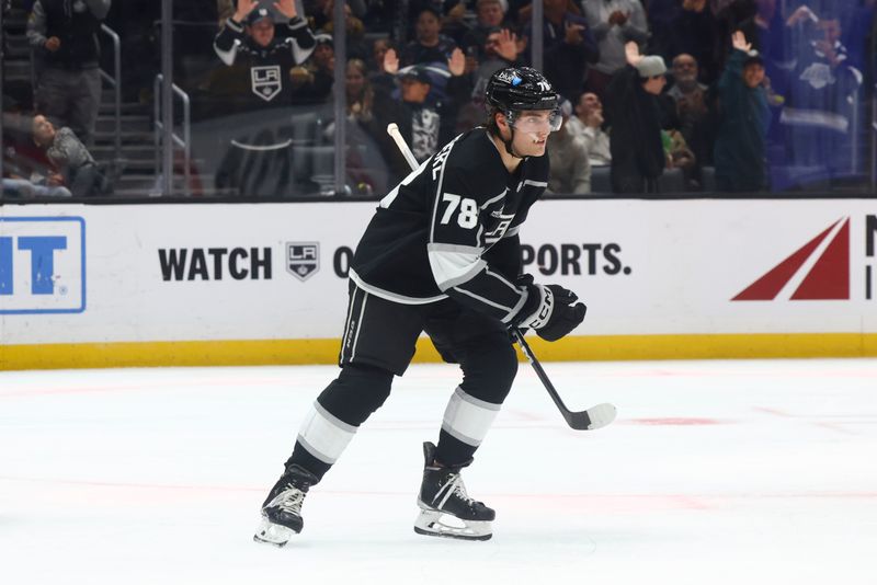 Dec 23, 2023; Los Angeles, California, USA; Los Angeles Kings right wing Alex Laferriere (78) skates towards the bench after scoring a goal against the Calgary Flames during the second period at Crypto.com Arena. Mandatory Credit: Jessica Alcheh-USA TODAY Sports