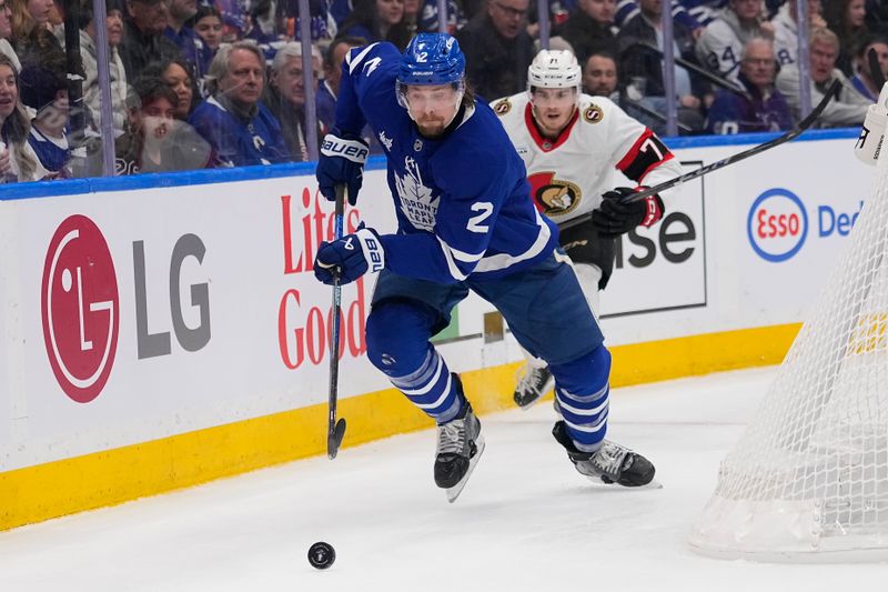 Apr 20, 2025; Toronto, Ontario, CAN; Toronto Maple Leafs defenceman Simon Benoit (2) skates after a loose puck against the Ottawa Senators during the second period of game one of the first round of the 2025 Stanley Cup Playoffs at Scotiabank Arena. Mandatory Credit: John E. Sokolowski-Imagn Images