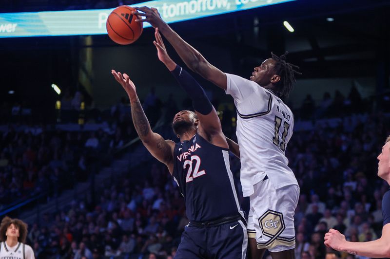 Jan 20, 2024; Atlanta, Georgia, USA; Virginia Cavaliers forward Jordan Minor (22) and Georgia Tech Yellow Jackets forward Baye Ndongo (11) reach for a rebound in the second half at McCamish Pavilion. Mandatory Credit: Brett Davis-USA TODAY Sports