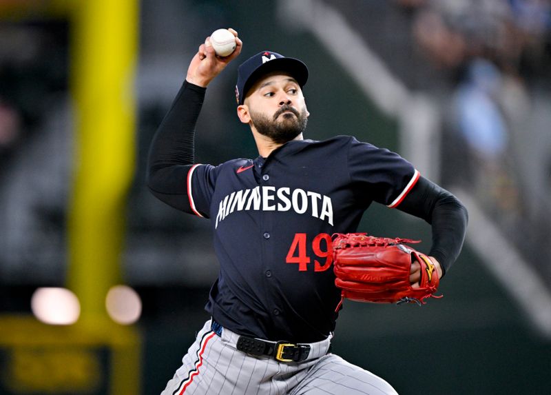 Aug 18, 2024; Arlington, Texas, USA; Minnesota Twins starting pitcher Pablo Lopez (49) pitches against the Texas Rangers during the fourth inning at Globe Life Field. Mandatory Credit: Jerome Miron-USA TODAY Sports