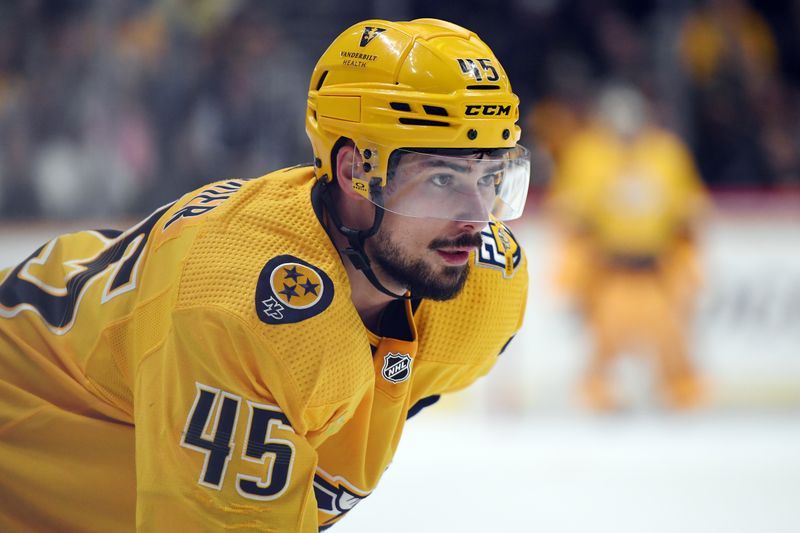 Mar 5, 2024; Nashville, Tennessee, USA; Nashville Predators defenseman Alexandre Carrier (45) waits for a face off during the first period against the Montreal Canadiens at Bridgestone Arena. Mandatory Credit: Christopher Hanewinckel-USA TODAY Sports