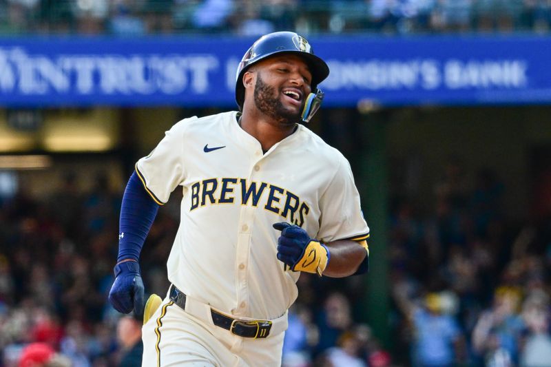 Sep 2, 2024; Milwaukee, Wisconsin, USA; Milwaukee Brewers left fielder Jackson Chourio (11) reacts after hitting a grand slam home run in the sixth inning against the St. Louis Cardinals at American Family Field. Mandatory Credit: Benny Sieu-USA TODAY Sports