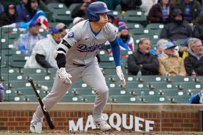 Apr 7, 2024; Chicago, Illinois, USA; Los Angeles Dodgers designated hitter Shohei Ohtani (17) hits a triple against the Chicago Cubs during the sixth inning at Wrigley Field. Mandatory Credit: David Banks-USA TODAY Sports