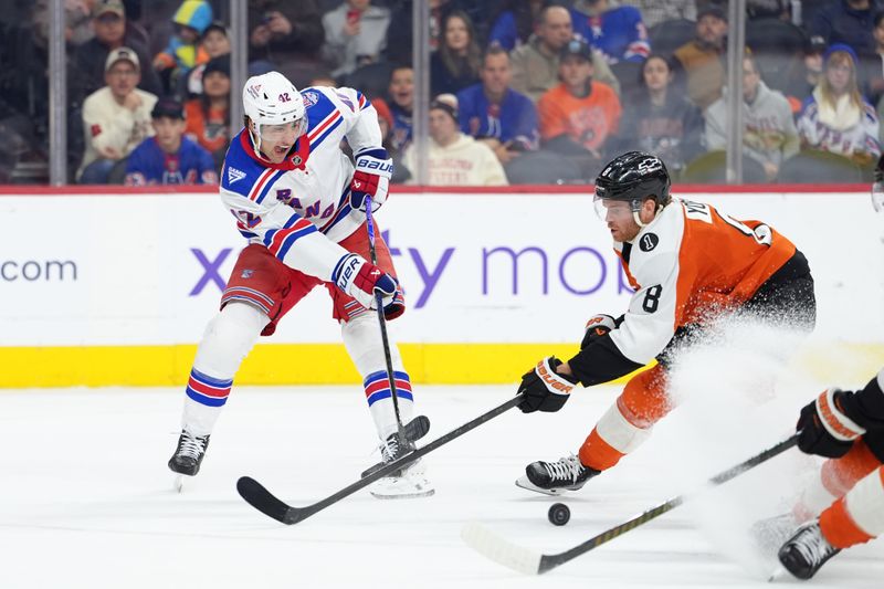 Jan 17, 2026; Philadelphia, Pennsylvania, USA; New York Rangers center Noah Laba (42) passes the puck against Philadelphia Flyers defenseman Cam York (8) in the first period at Xfinity Mobile Arena. Mandatory Credit: Kyle Ross-Imagn Images