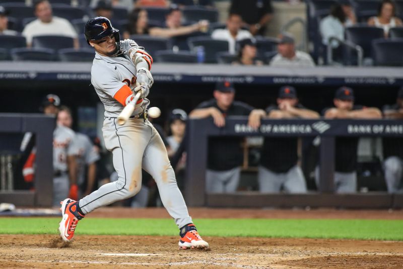 Sep 5, 2023; Bronx, New York, USA;  Detroit Tigers shortstop Javier Baez (28) hits a single in the ninth inning against the New York Yankees at Yankee Stadium. Mandatory Credit: Wendell Cruz-USA TODAY Sports