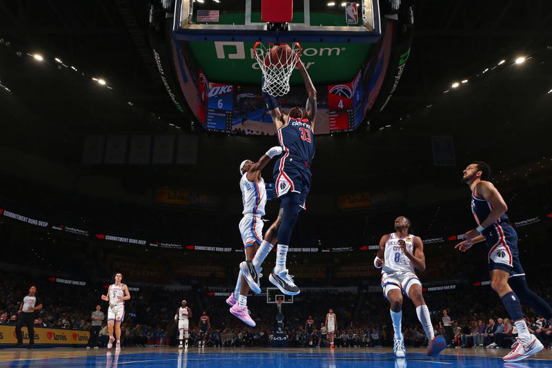 OKLAHOMA CITY, OK - FEBRUARY 23: Kyle Kuzma #33 of the Washington Wizards dunks the ball during the game against the Oklahoma City Thunder on February 23, 2024 at Paycom Arena in Oklahoma City, Oklahoma. NOTE TO USER: User expressly acknowledges and agrees that, by downloading and or using this photograph, User is consenting to the terms and conditions of the Getty Images License Agreement. Mandatory Copyright Notice: Copyright 2024 NBAE (Photo by Zach Beeker/NBAE via Getty Images)