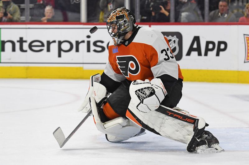 Jan 27, 2025; Philadelphia, Pennsylvania, USA; Philadelphia Flyers goaltender Samuel Ersson (33) makes a save against the New Jersey Devils during the second period at Wells Fargo Center. Mandatory Credit: Eric Hartline-Imagn Images