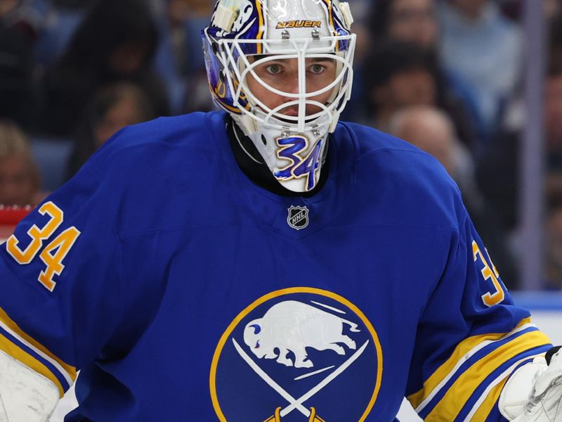 Oct 13, 2025; Buffalo, New York, USA;  Buffalo Sabres goaltender Alex Lyon (34) looks for the puck during the third period against the Colorado Avalanche at KeyBank Center. Mandatory Credit: Timothy T. Ludwig-Imagn Images