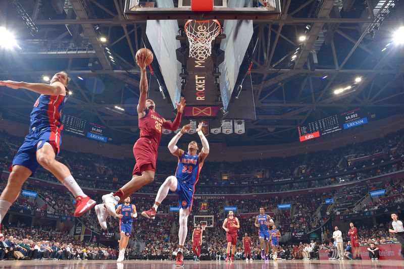 CLEVELAND, OH - JANUARY 31: Isaac Okoro #35 of the Cleveland Cavaliers drives to the basket during the game against the Detroit Pistons on January 31, 2024 at Rocket Mortgage FieldHouse in Cleveland, Ohio. NOTE TO USER: User expressly acknowledges and agrees that, by downloading and/or using this Photograph, user is consenting to the terms and conditions of the Getty Images License Agreement. Mandatory Copyright Notice: Copyright 2024 NBAE (Photo by David Liam Kyle/NBAE via Getty Images)