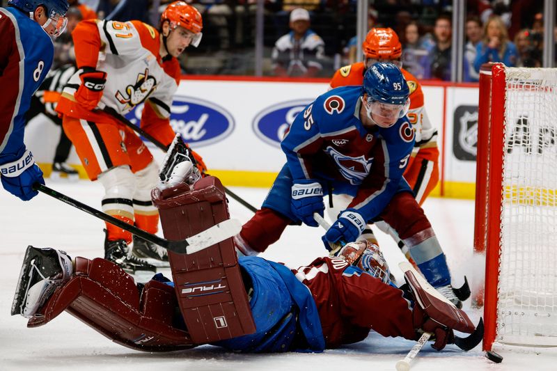 Jan 21, 2026; Denver, Colorado, USA; Colorado Avalanche goaltender Scott Wedgewood (41) and left wing Victor Olofsson (95) clear the puck from the goal line in the third period against the Anaheim Ducks at Ball Arena. Mandatory Credit: Isaiah J. Downing-Imagn Images