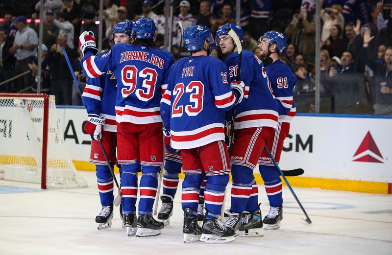 Sep 24, 2024; New York, New York, USA; New York Rangers left wing Chris Kreider (20) celebrates his goal with defenseman Adam Fox (23) during the third period against the New York Islanders at Madison Square Garden. Mandatory Credit: Danny Wild-Imagn Images