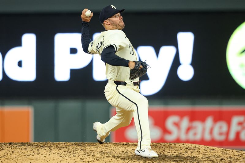 Aug 28, 2024; Minneapolis, Minnesota, USA; Minnesota Twins relief pitcher Caleb Thielbar (56) delivers a pitch against the Atlanta Braves during the seventh inning at Target Field. Mandatory Credit: Matt Krohn-USA TODAY Sports