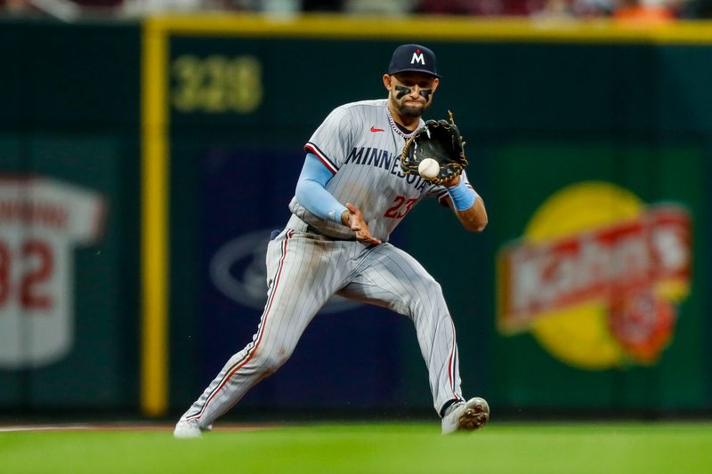 Sep 18, 2023; Cincinnati, Ohio, USA; Minnesota Twins third baseman Royce Lewis (23) fields the ball hit by Cincinnati Reds shortstop Elly De La Cruz (not pictured) in the seventh inning at Great American Ball Park. Mandatory Credit: Katie Stratman-USA TODAY Sports