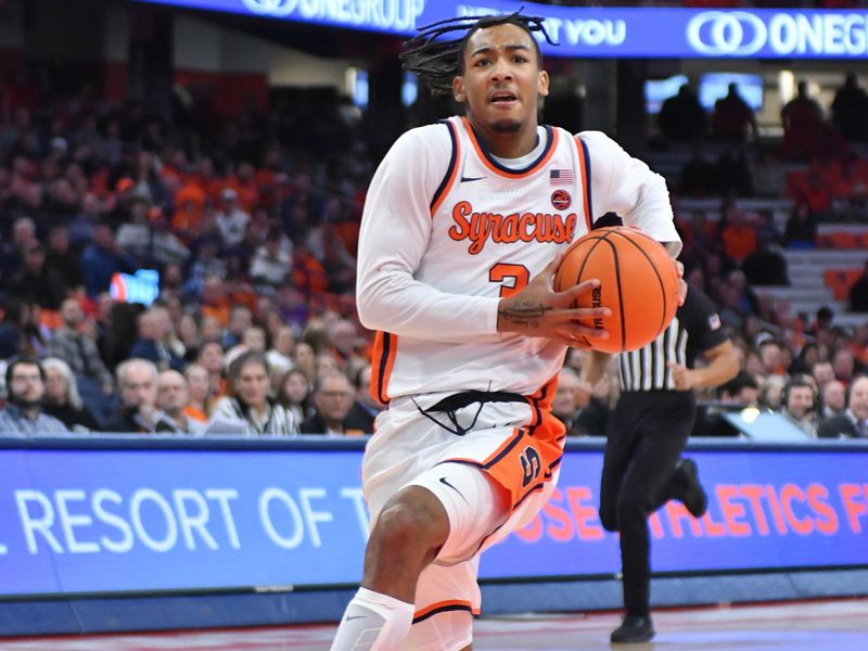 Dec 21, 2023; Syracuse, New York, USA; Syracuse Orange guard Judah Mintz (3) goes for a lay up against the Niagara Purple Eagles in the second half at the JMA Wireless Dome. Mandatory Credit: Mark Konezny-USA TODAY Sports