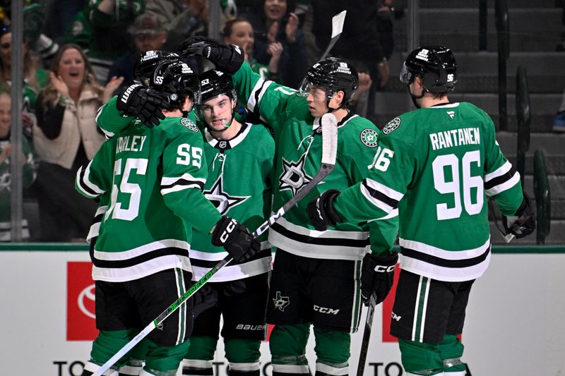 Mar 18, 2025; Dallas, Texas, USA; Dallas Stars center Roope Hintz (24) and defenseman Thomas Harley (55) and center Wyatt Johnston (53) and left wing Jason Robertson (21) and right wing Mikko Rantanen (96) celebrates a power play goal scored by Johnston against the Anaheim Ducks during the first period at the American Airlines Center. Mandatory Credit: Jerome Miron-Imagn Images