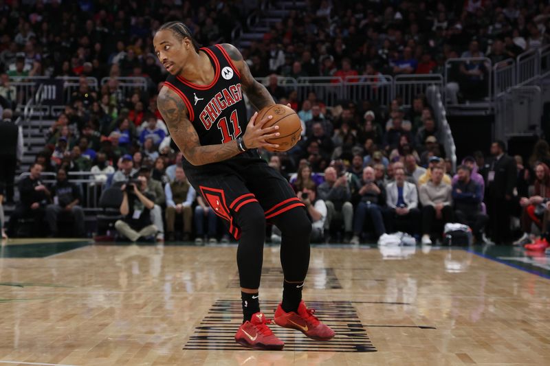 MILWAUKEE, WISCONSIN - NOVEMBER 13: DeMar DeRozan #11 of the Chicago Bulls handles the ball during a game against the Milwaukee Bucks at Fiserv Forum on November 13, 2023 in Milwaukee, Wisconsin. NOTE TO USER: User expressly acknowledges and agrees that, by downloading and or using this photograph, User is consenting to the terms and conditions of the Getty Images License Agreement. (Photo by Stacy Revere/Getty Images)