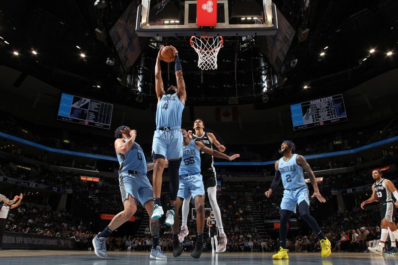 MEMPHIS, TN - APRIL 9: Jordan Goodwin #4 of the Memphis Grizzlies grabs a rebound during the game against the San Antonio Spurs on April 9, 2024 at FedExForum in Memphis, Tennessee. NOTE TO USER: User expressly acknowledges and agrees that, by downloading and or using this photograph, User is consenting to the terms and conditions of the Getty Images License Agreement. Mandatory Copyright Notice: Copyright 2024 NBAE (Photo by Joe Murphy/NBAE via Getty Images)