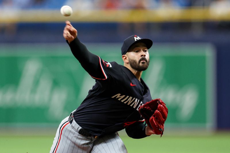 Sep 5, 2024; St. Petersburg, Florida, USA; Minnesota Twins pitcher Pablo Lopez (49) throws a pitch against the Tampa Bay Rays in the first inning at Tropicana Field. Mandatory Credit: Nathan Ray Seebeck-Imagn Images