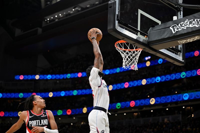 SEATTLE, WASHINGTON - OCTOBER 11: Derrick Jones Jr. #55 of the LA Clippers dunks the ball during the second quarter of the Rain City Showcase game against the Portland Trail Blazers at Climate Pledge Arena on October 11, 2024 in Seattle, Washington. The LA Clippers won 101-99. NOTE TO USER: User expressly acknowledges and agrees that, by downloading and or using this photograph, User is consenting to the terms and conditions of the Getty Images License Agreement. (Photo by Alika Jenner/Getty Images)