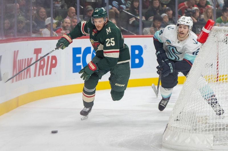 Oct 12, 2024; Saint Paul, Minnesota, USA; Minnesota Wild defenseman Jonas Brodin (25) and Seattle Kraken left wing Tye Kartye (12) chase the puck behind the Minnesota Wild net in the first period at Xcel Energy Center. Mandatory Credit: Matt Blewett-Imagn Images