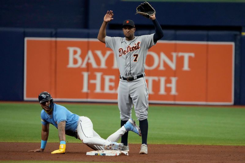 Apr 2, 2023; St. Petersburg, Florida, USA; Tampa Bay Rays center fielder Jose Siri (22) steals second as Detroit Tigers third baseman Jonathan Schoop (7) looks on during the sixth inning at Tropicana Field. Mandatory Credit: Dave Nelson-USA TODAY Sports