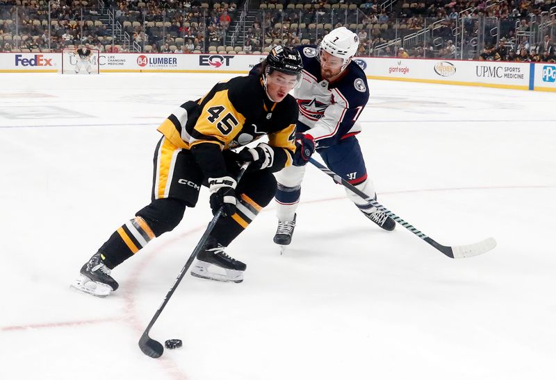 Oct 4, 2024; Pittsburgh, Pennsylvania, USA;  Pittsburgh Penguins defenseman Harrison Brunicke (45) skates in on goal against Columbus Blue Jackets center Sean Kuraly (7) during the first period at PPG Paints Arena. Mandatory Credit: Charles LeClaire-Imagn Images