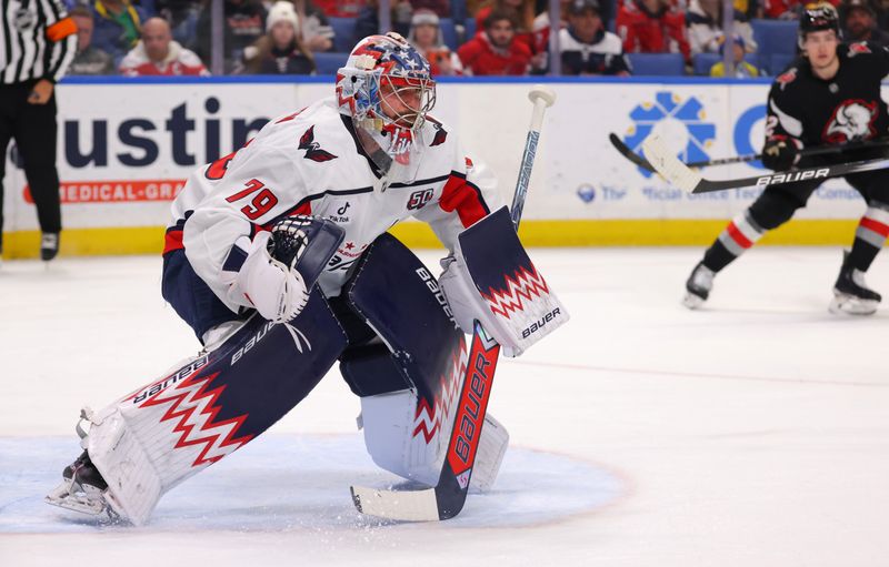 Jan 6, 2025; Buffalo, New York, USA;  Washington Capitals goaltender Charlie Lindgren (79) looks for the puck during the second period against the Buffalo Sabres at KeyBank Center. Mandatory Credit: Timothy T. Ludwig-Imagn Images