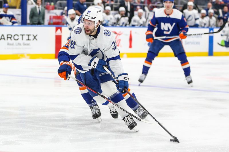 Feb 24, 2024; Elmont, New York, USA;  Tampa Bay Lightning left wing Brandon Hagel (38) controls the puck in the third period against the New York Islanders at UBS Arena. Mandatory Credit: Wendell Cruz-USA TODAY Sports