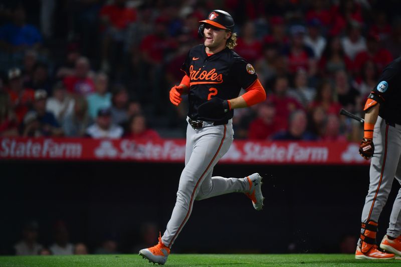 May 10, 2025; Anaheim, California, USA; Baltimore Orioles designated hitter Gunnar Henderson (2) scores a run against the Los Angeles Angels during the sixth inning at Angel Stadium. Mandatory Credit: Gary A. Vasquez-Imagn Images