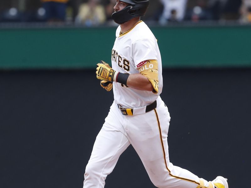 Aug 17, 2024; Pittsburgh, Pennsylvania, USA;  Pittsburgh Pirates second baseman Jared Triolo (19) circles the bases on a solo home run against the Seattle Mariners during the seventh inning at PNC Park. Mandatory Credit: Charles LeClaire-USA TODAY Sports