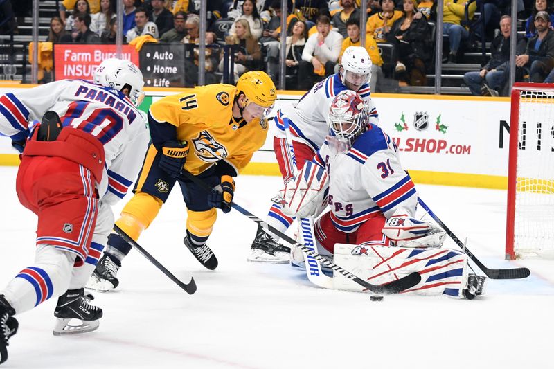 Dec 2, 2023; Nashville, Tennessee, USA; Nashville Predators center Gustav Nyquist (14) has a shot blocked by New York Rangers goaltender Igor Shesterkin (31) during the third period at Bridgestone Arena. Mandatory Credit: Christopher Hanewinckel-USA TODAY Sports