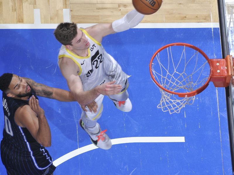 ORLANDO, FL - JANUARY 5 :  Kyle Filipowski #22 of the Utah Jazz drives to the basket during the game against the Orlando Magic on January 5, 2025 at Kia Center in Orlando, Florida. NOTE TO USER: User expressly acknowledges and agrees that, by downloading and or using this photograph, User is consenting to the terms and conditions of the Getty Images License Agreement. Mandatory Copyright Notice: Copyright 2025 NBAE (Photo by Fernando Medina/NBAE via Getty Images)