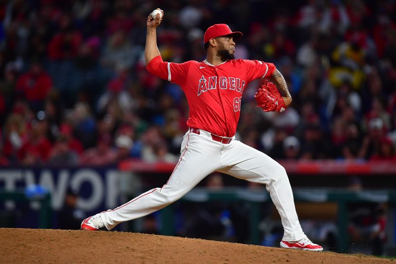 Apr 27, 2024; Anaheim, California, USA; Los Angeles Angels pitcher José Cisnero (67) throws against the Minnesota Twins during the fourth inning at Angel Stadium. Mandatory Credit: Gary A. Vasquez-USA TODAY Sports