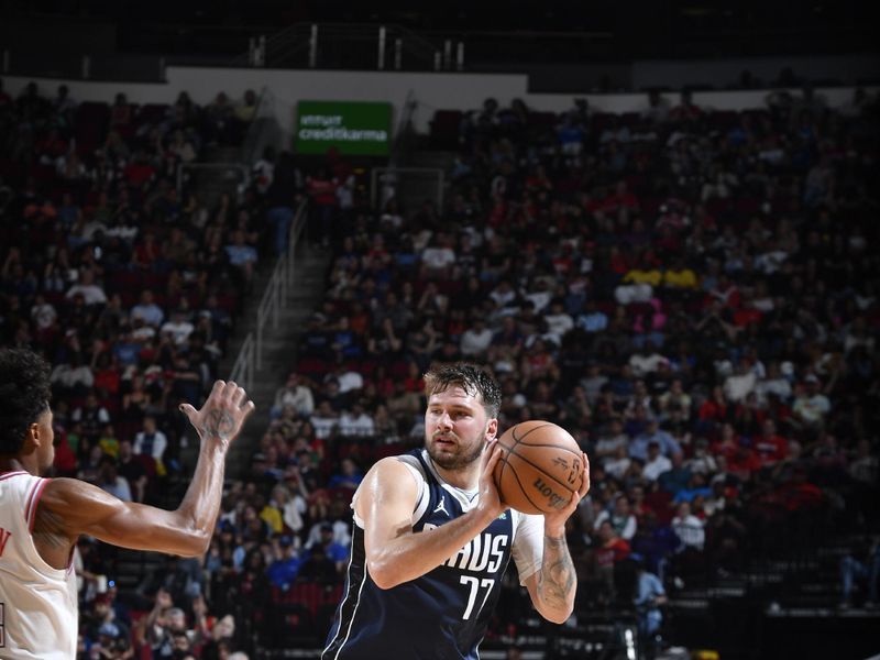 HOUSTON, TX - MARCH 31: Luka Doncic #77 of the Dallas Mavericks handles the ball during the game against the Houston Rockets on March 31, 2024 at the Toyota Center in Houston, Texas. NOTE TO USER: User expressly acknowledges and agrees that, by downloading and or using this photograph, User is consenting to the terms and conditions of the Getty Images License Agreement. Mandatory Copyright Notice: Copyright 2024 NBAE (Photo by Logan Riely/NBAE via Getty Images)